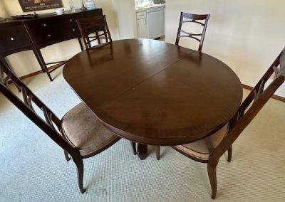 Dining table with 4 chairs, smallest size is 44" wide and includes one leaf, 18" wide