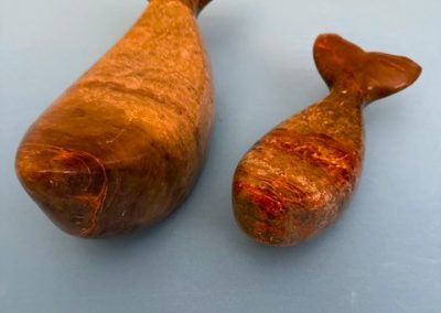 Hand carved stone Whales by Louis Wilson