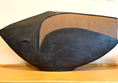 This stylized fish sculpture is a work by the renowned artist Dennis Fairweather